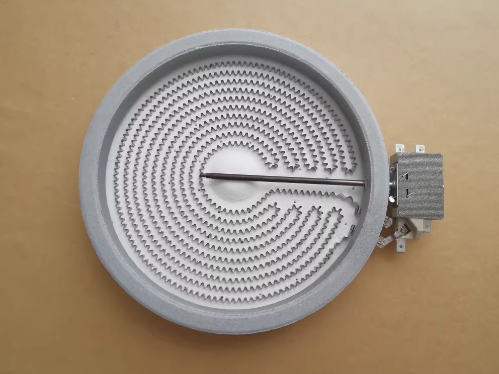 Illustration of heat distribution inside an electric oven, showing glowing heating elements at the bottom and fan for convection.